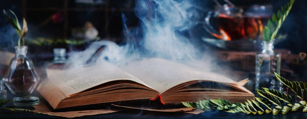 Open sorcery book with magic smoke coming out of it. It helps on the creation of a good storytelling.